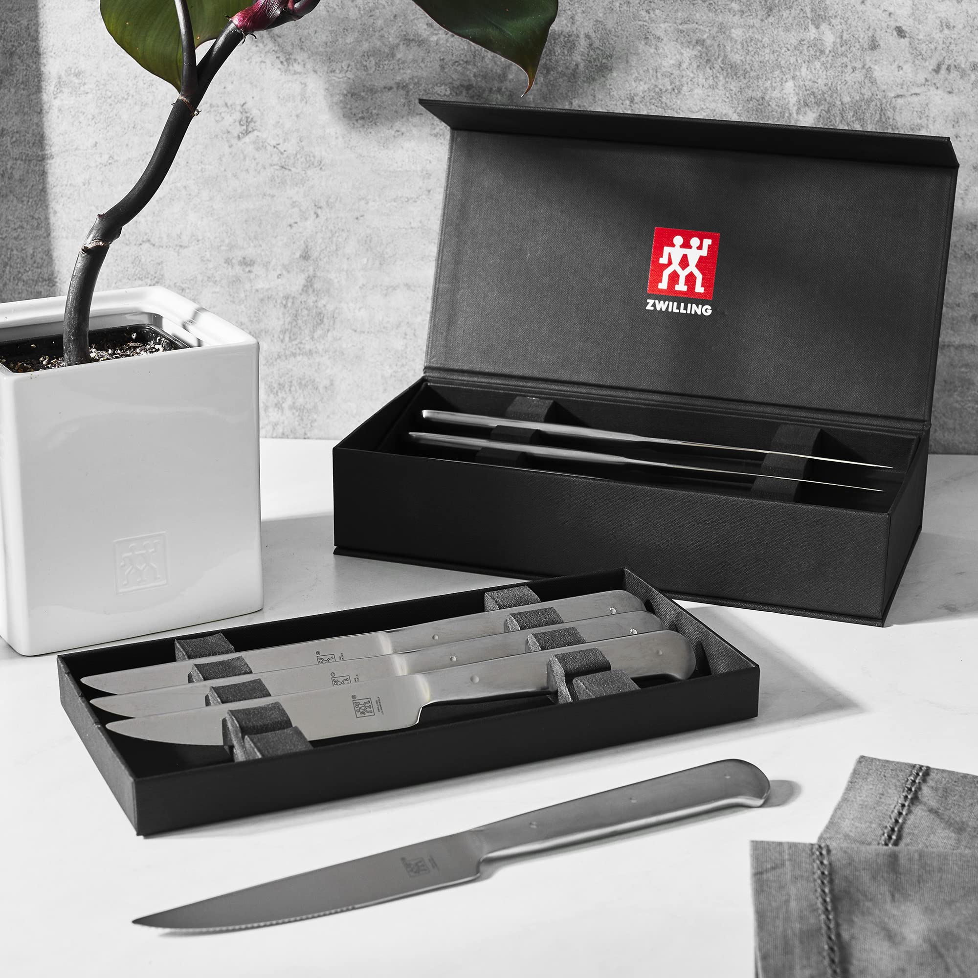 ZWILLING ergonomic stainless-steel handles offer a secure grip.