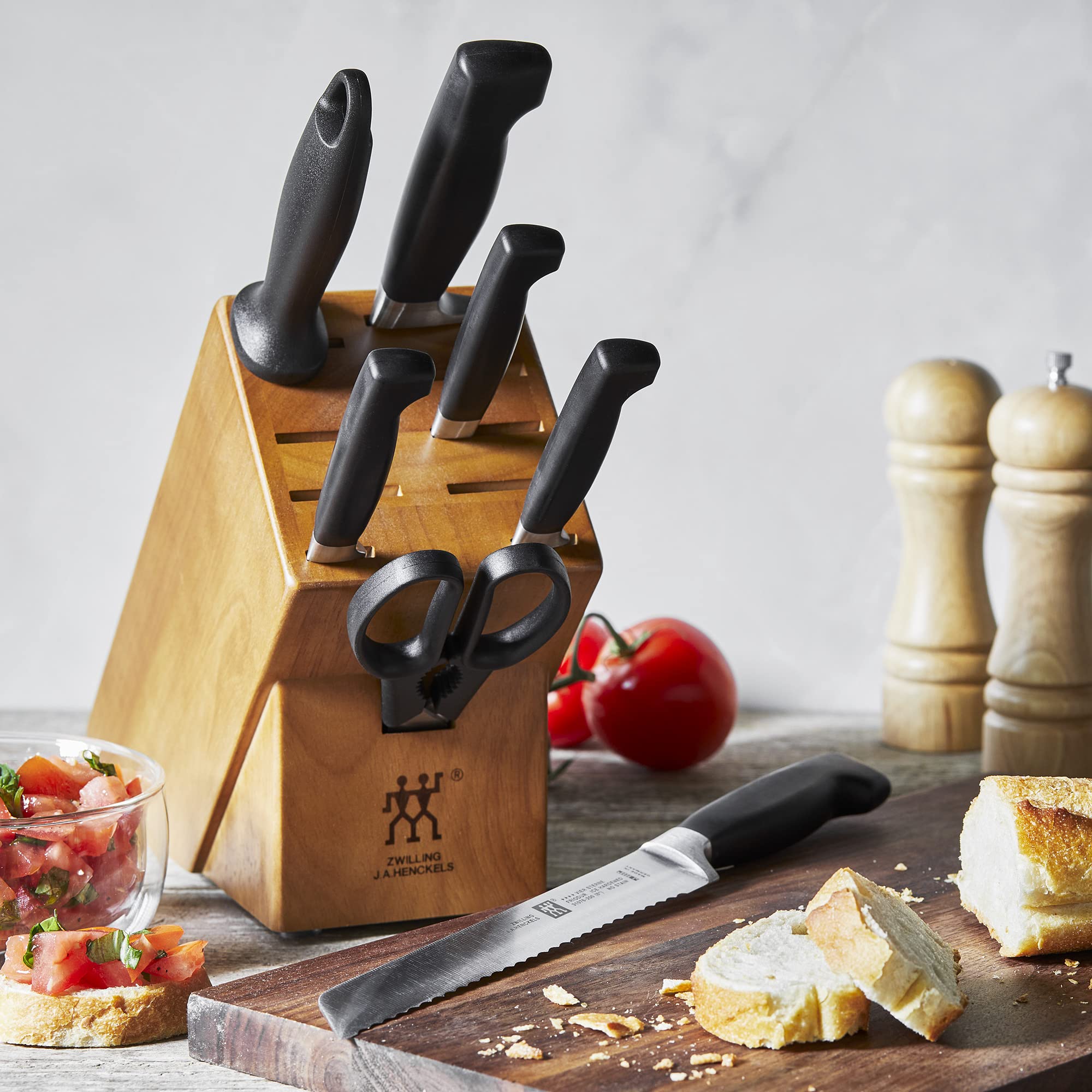 ZWILLING Four Star Anniversary chef knife optimized for effortless chopping.