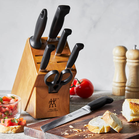ZWILLING Four Star Anniversary chef knife optimized for effortless chopping.