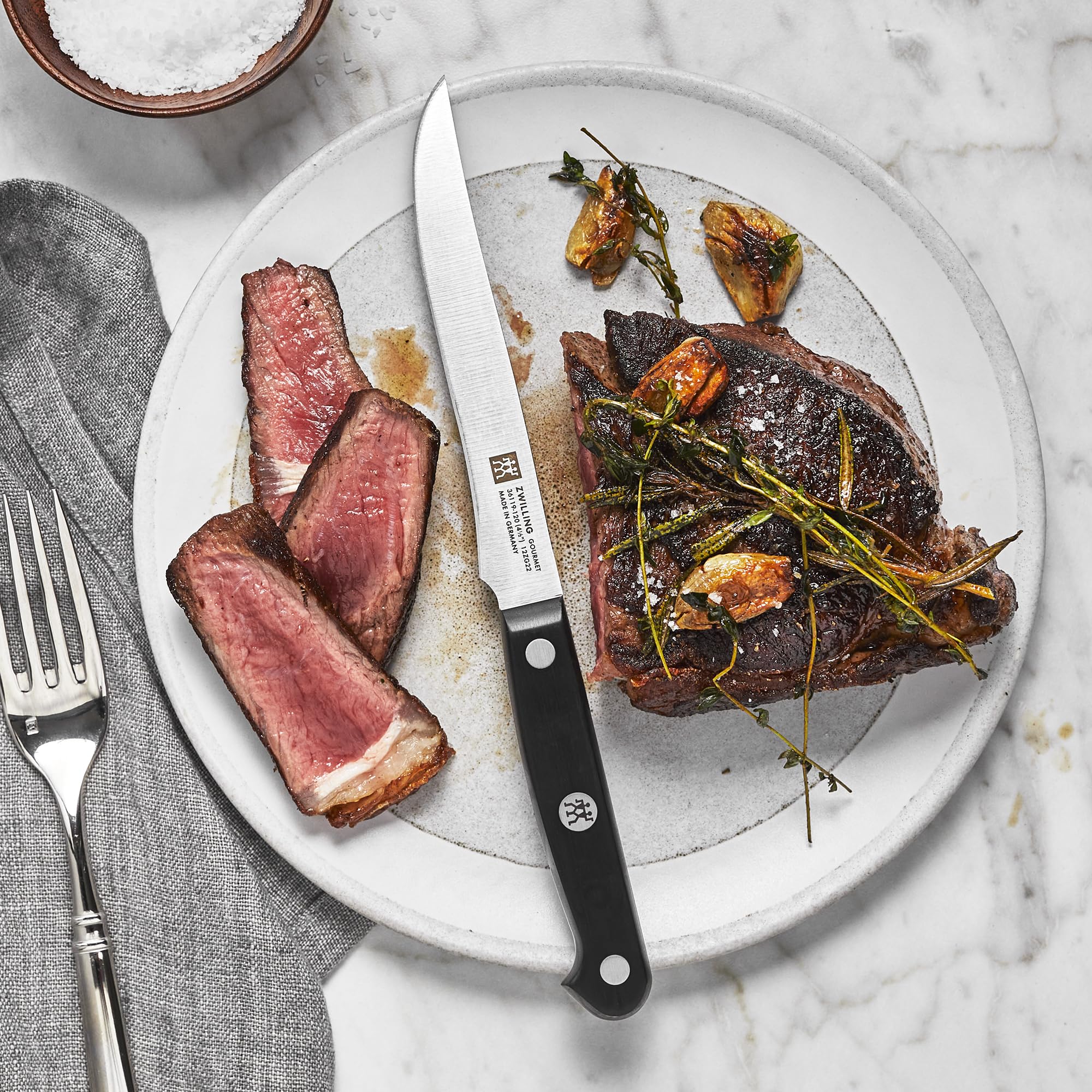 ZWILLING Gourmet 6pc steak knife set ergonomic handle detail for comfortable cutting.