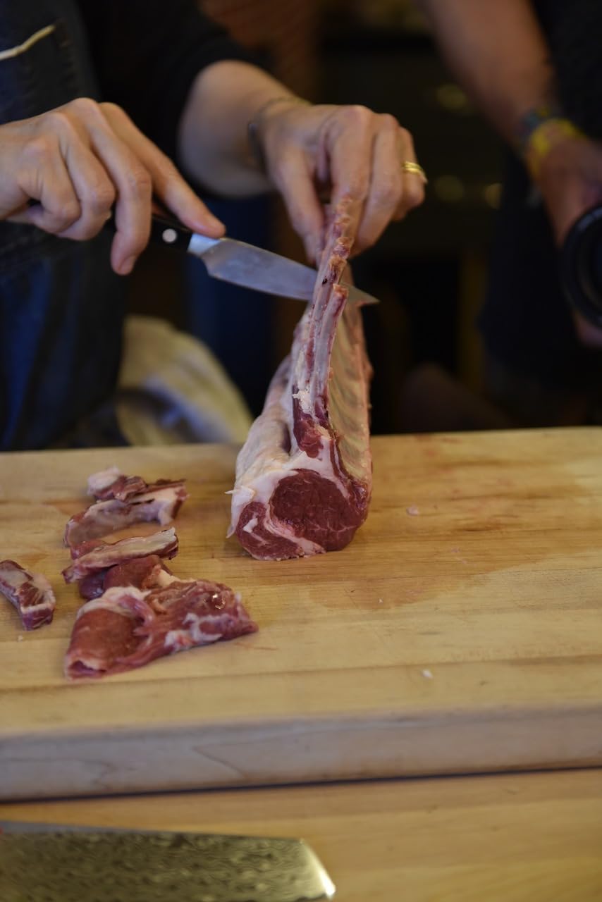 Zwilling Pro paring knife reflective blade for smooth slicing.