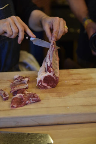 Zwilling Pro paring knife reflective blade for smooth slicing.