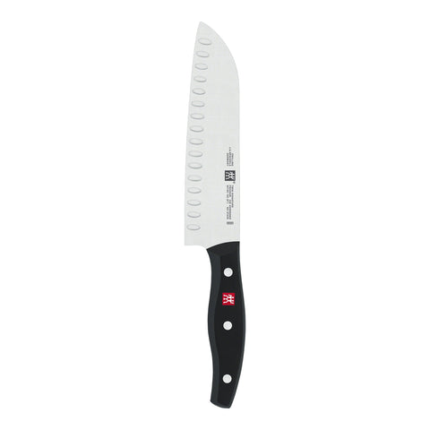 ZWILLING Twin Signature 7-inch hollow-edge Santoku blade for precise slicing.