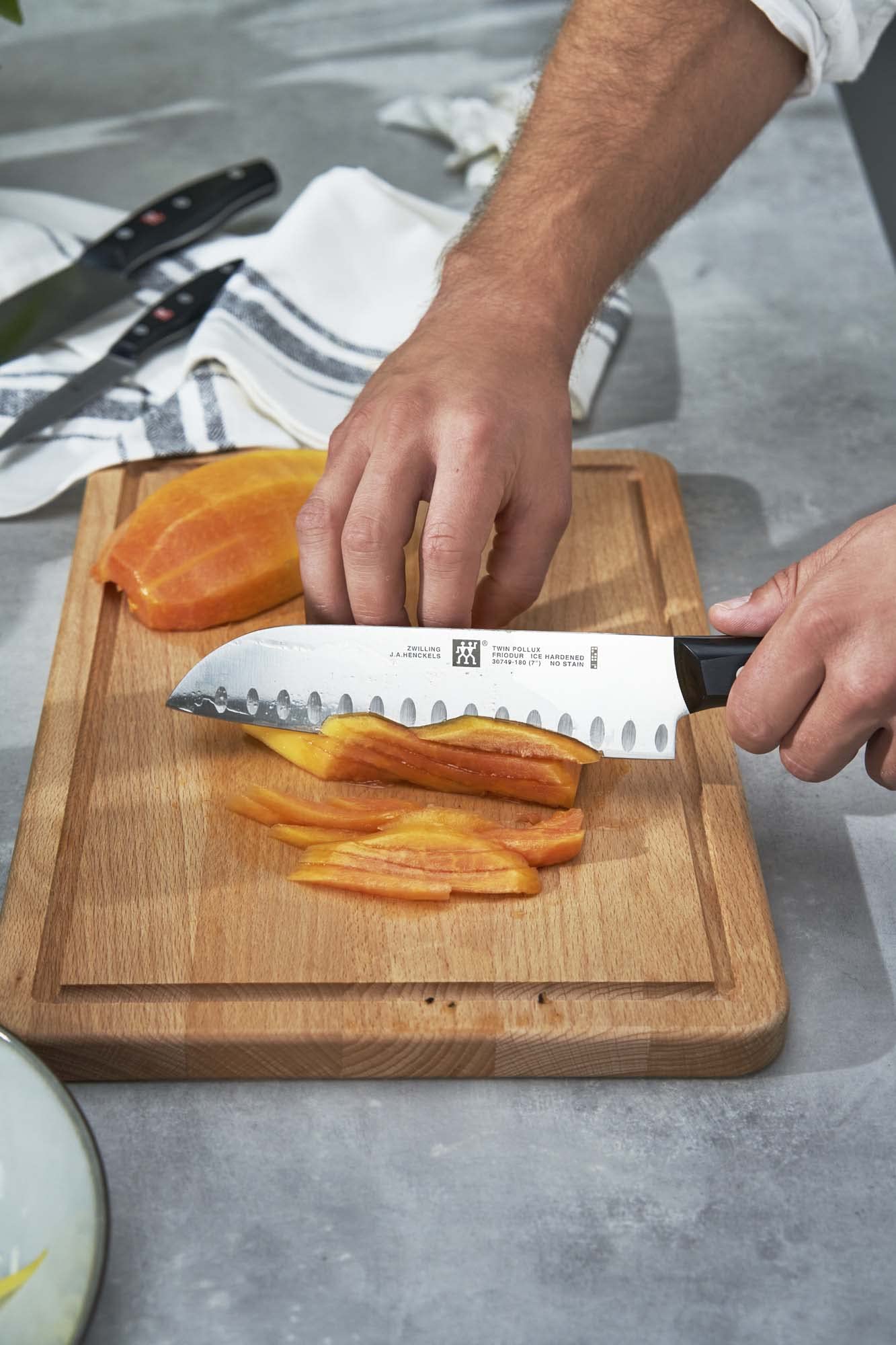 ZWILLING Twin Signature one-piece stamped blade reduces weight without sacrificing strength.