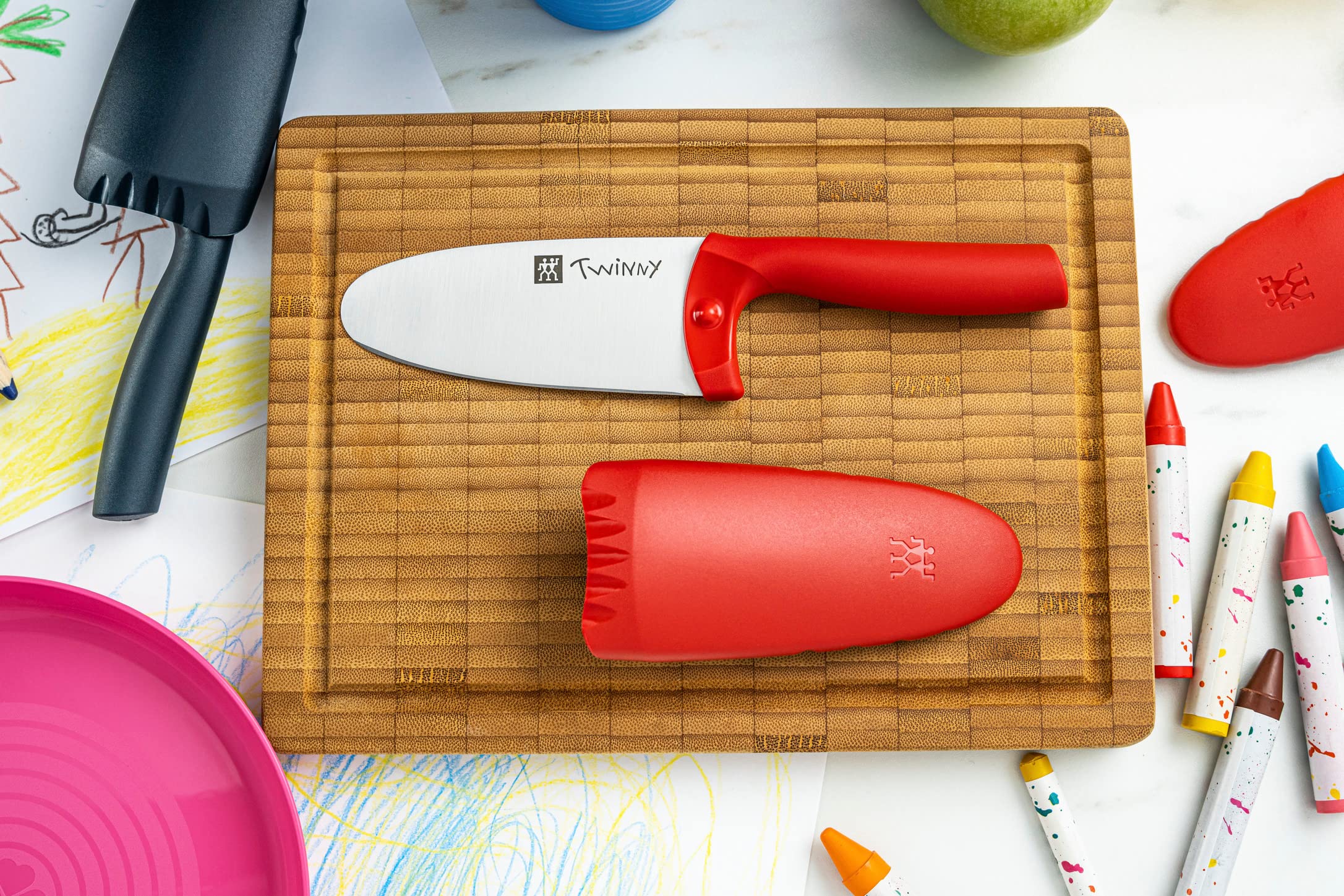 Zwilling Twinny blade close-up shows rounded safety edge for gentle fruit slicing.