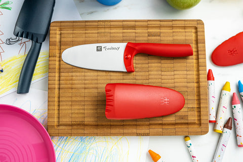 Zwilling Twinny blade close-up shows rounded safety edge for gentle fruit slicing.