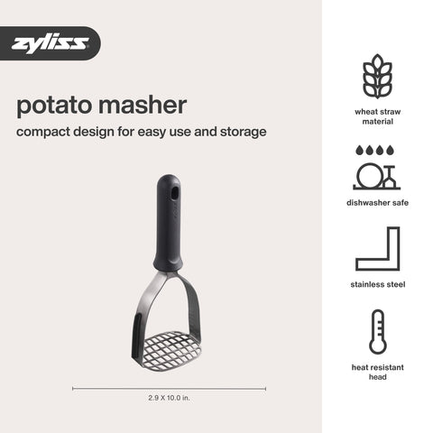 Zyliss potato masher in use inside a bowl for mashing.